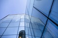 Office building glass facades on a bright sunny day with sunbeams in the blue sky. Royalty Free Stock Photo