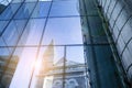 Office building glass facades on a bright sunny day with sunbeams in the blue sky. Royalty Free Stock Photo