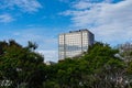 Office building and green space on blue sky background Royalty Free Stock Photo