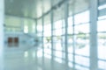 Office building lobby hall blur background or blurry school hallway corridor interior view looking toward empty entrance, glass Royalty Free Stock Photo