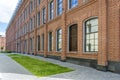 Office building in loft style. large Windows. Red brick wall. Royalty Free Stock Photo