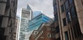 Office building in London, England. Mixture of old and new buildings. Windows of Skyscraper Business Office, Corporate building in Royalty Free Stock Photo