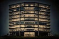 Office building at night with glass windows, front view, Generative AI Royalty Free Stock Photo