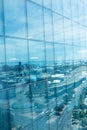 Office building with reflection of city against sky Royalty Free Stock Photo