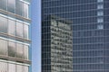 Office building with reflections in glass facade of another building Royalty Free Stock Photo