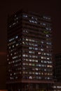 Office building silhouette with street lights reflections Royalty Free Stock Photo