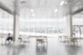 Office building or university lobby hall blur background with blurry school hallway corridor interior view toward empty corridor Royalty Free Stock Photo