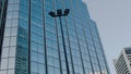 Office building windows and bottom view of skyscraper building with many corporate offices of successful companies. Real estate Royalty Free Stock Photo