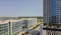 Office buildings and modern condominium tower surrounding by multistory apartment building, modern villas, in downtown Plano,