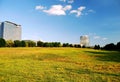 Office buildings and open field Royalty Free Stock Photo