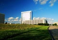 Office buildings and open field Royalty Free Stock Photo