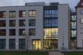 office buildings with sunset autumn colored sky and clouds Royalty Free Stock Photo