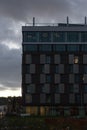 office buildings with sunset autumn colored sky and clouds Royalty Free Stock Photo