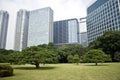 Office buildings surrounding Japanese garden Royalty Free Stock Photo