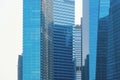 Office buildings windows. Blue glass architecture facade design with reflection of sky in urban city, Downtown Singapore City in Royalty Free Stock Photo