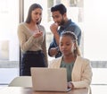 Office bully, woman and working at laptop with coworkers talking in a corporate workplace with gossip. Young black Royalty Free Stock Photo