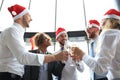 Office business coworkers celebrating winter holidays together at work and drinking champagne in office Royalty Free Stock Photo