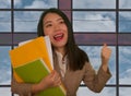 Office and business lifestyle - portrait of young happy and excited Asian Korean woman at work celebrating project success smiling