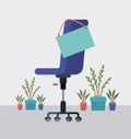 Office chair iwith label hanging and house plants