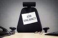 Office chair with job vacancy sign Royalty Free Stock Photo