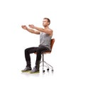 Office chair, man and exercise for posture with health and fitness in white background or studio. Sitting, workout and Royalty Free Stock Photo
