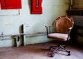 Office chair in prison room Royalty Free Stock Photo