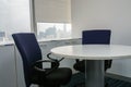 Office chair and white round table in meeting room