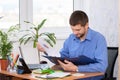 Office clerk reads documents in a folder