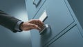 Office clerk searching files in the filing cabinet Royalty Free Stock Photo