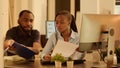 Office colleagues doing teamwork to create web presentation Royalty Free Stock Photo