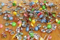 Office colored paper clips and drawing pins scattered on a table Royalty Free Stock Photo