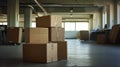 Office corner with empty boxes and tape ready for packing up desks after layoffs and downsizing Royalty Free Stock Photo