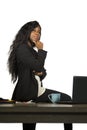 Office corporate company portrait of young happy and attractive black African American businesswoman standing at her computer desk Royalty Free Stock Photo