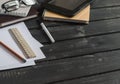 Office desk with business objects - open notebook, tablet computer, glasses, ruler, pencil, pen. Free space for text. Royalty Free Stock Photo