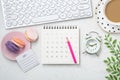 Office desk with calendar, computer keyboard and coffee cup Royalty Free Stock Photo