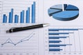 Office desk with charts , histograms and financial documents Royalty Free Stock Photo