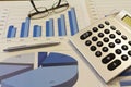 Office desk with charts , histograms and financial documents Royalty Free Stock Photo