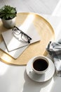 Office desk with coffee cup, succulent plant, eyeglasses and notepad. Minimal style image of business table Royalty Free Stock Photo