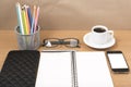 Office desk : coffee with phone,notepad,eyeglasses,wallet,color Royalty Free Stock Photo