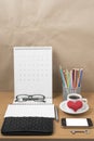 office desk : coffee with phone,wallet,calendar,heart,notepad,eyeglasses,color pencil box,key Royalty Free Stock Photo