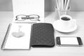 office desk : coffee with phone,wallet,calendar,heart,notepad,eyeglasses,color pencil box,key black and white color Royalty Free Stock Photo