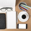 office desk : coffee with phone,wallet,calendar,heart,notepad,eyeglasses,color pencil box vintage style Royalty Free Stock Photo