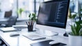 Office Desk With Computer Displaying Code. Modern Workplace With Tech, Workspace Setup For Programming Or Software Development Royalty Free Stock Photo