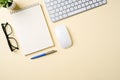 Office desk with computer keyboard, mouse, glasses, notebook and pen. Top view with copy space. Flat lay Royalty Free Stock Photo