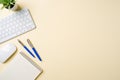 Office desk with computer keyboard, mouse, notebook and pen. Top view with copy space. Flat lay Royalty Free Stock Photo