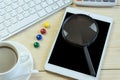 Office desk with copy space. Digital devices wireless keyboard and mouse on office table with notepad and cup of coffee,you can ap Royalty Free Stock Photo