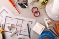 Office desk of electrical engineer with installation project and tools Royalty Free Stock Photo