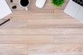 The office desk flat lay view with laptop, mouse, tree, black clip, coffee cup, notebook, pencil on wood texture background Royalty Free Stock Photo