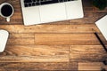 The office desk flat lay view with laptop, mouse, tree, black clip, coffee cup, notebook, pencil on wood texture background Royalty Free Stock Photo