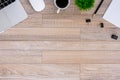 The office desk flat lay view with laptop, mouse, tree, black clip, coffee cup, notebook, pencil on wood texture background Royalty Free Stock Photo